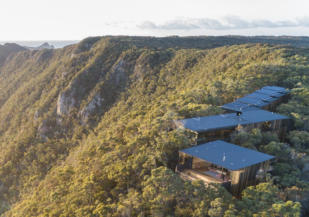 Aerial view of a Tasmanian coastal lodge surrounded by bushland