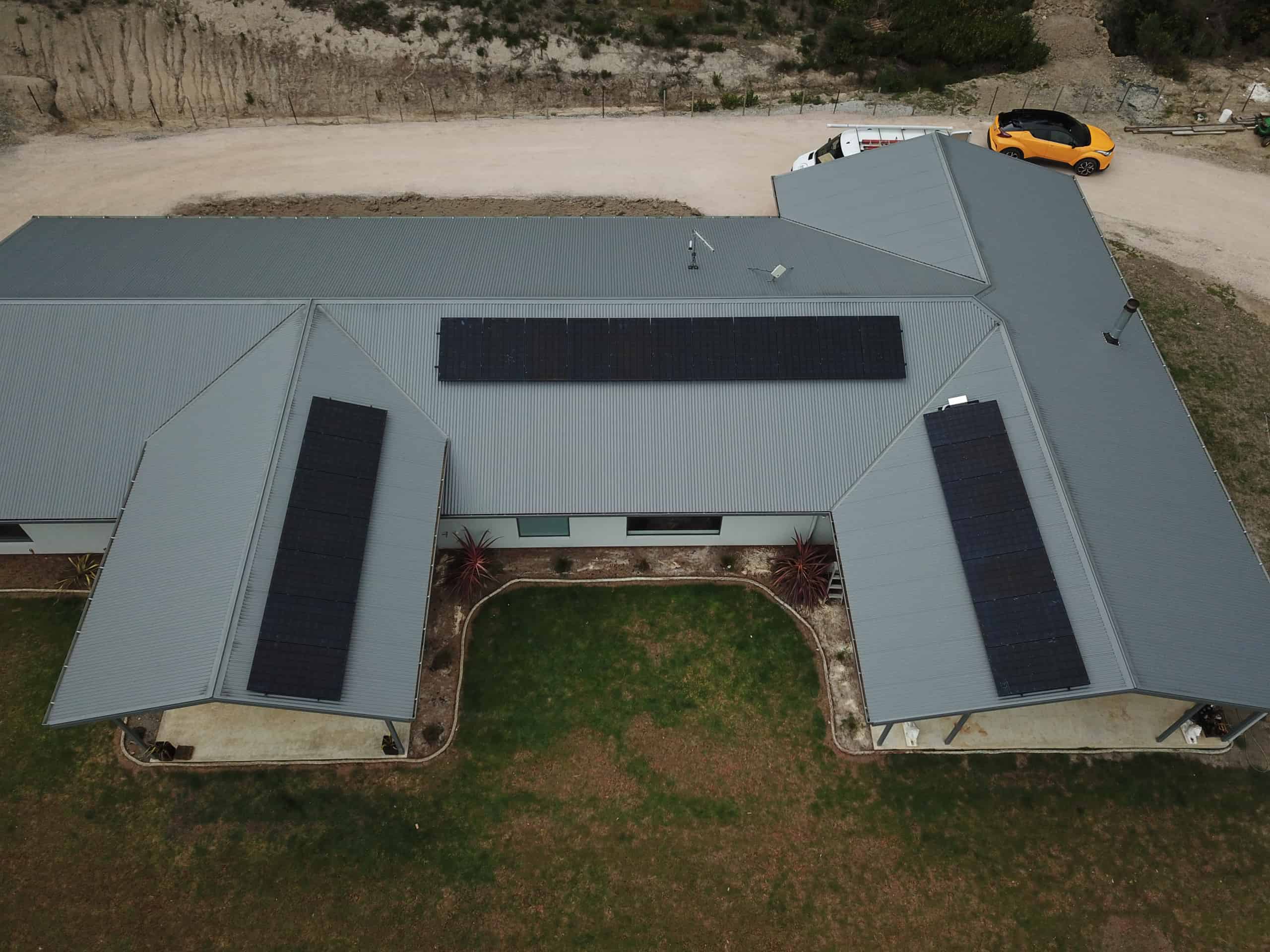 Aerial view of a Tasmanian home with a rooftop solar array